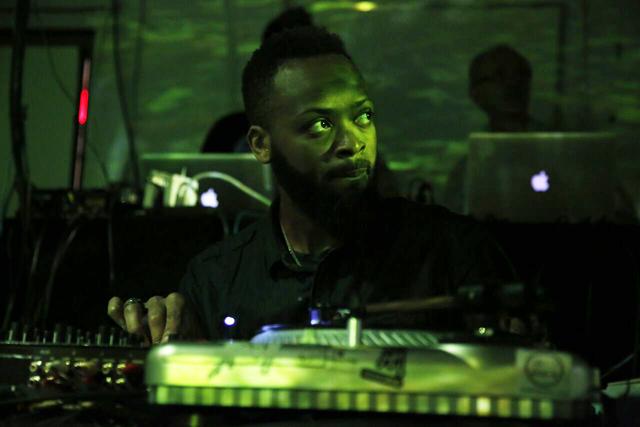 DJ, Cheldon Paterson 'SlowPitchSound', providing the sonic background