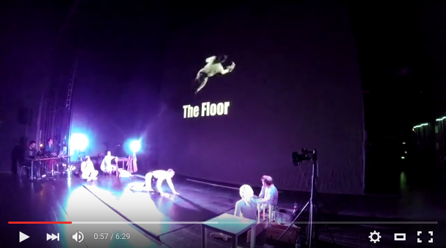 Video still of the actors and stage in 'The Floor'